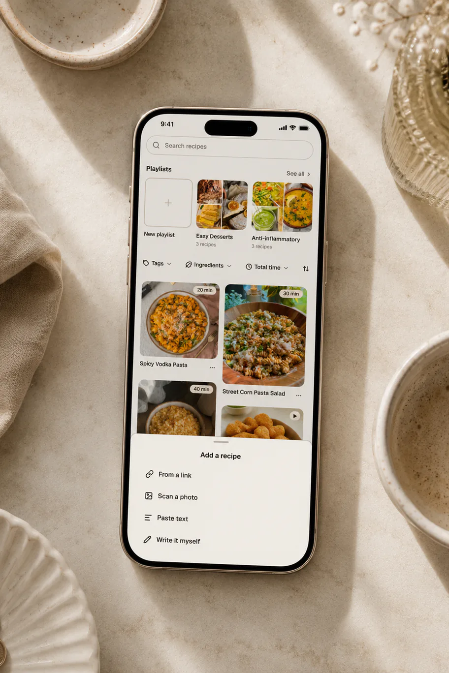 A phone showing Belly's add a recipe sheet: from a link, scan a photo, paste text, or write it myself