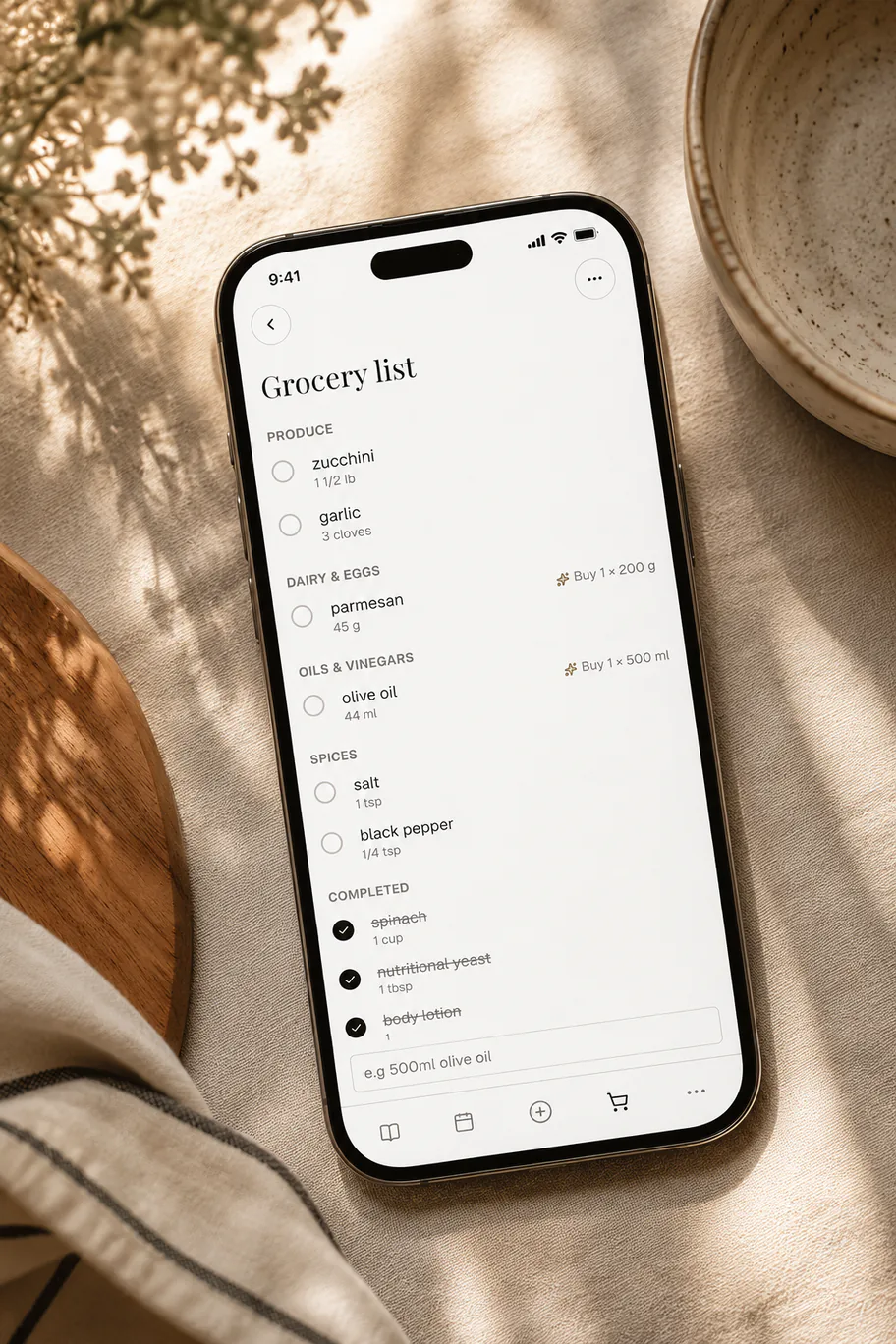 A phone showing a Belly grocery list grouped by aisle
